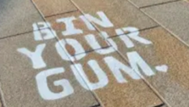 Bin Your Gum stencilled onto pavement.