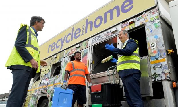 Minister Edwin Poots met Bryson Recycling’s Director Eric Randall and employee Philip Margaret, from a local collection team in Ballyclare, to see a kerbside box collection.