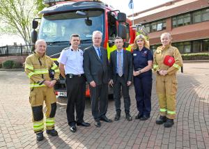 Health and DAERA Ministers pictured in front of a Fire Brigade truck with emergency personnel
